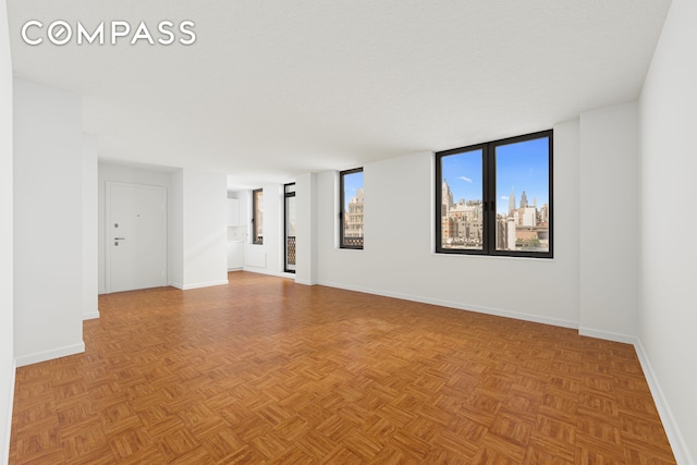 empty room with baseboards