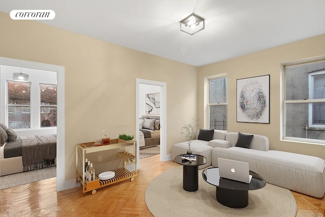 sitting room with baseboards and visible vents