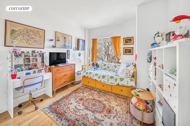 bedroom with wood finished floors and visible vents