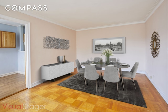 dining area with crown molding and baseboards