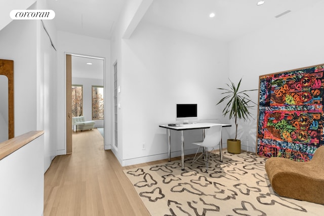 home office with recessed lighting, light wood finished floors, and visible vents