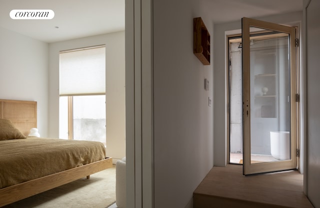 bedroom with wood finished floors and visible vents