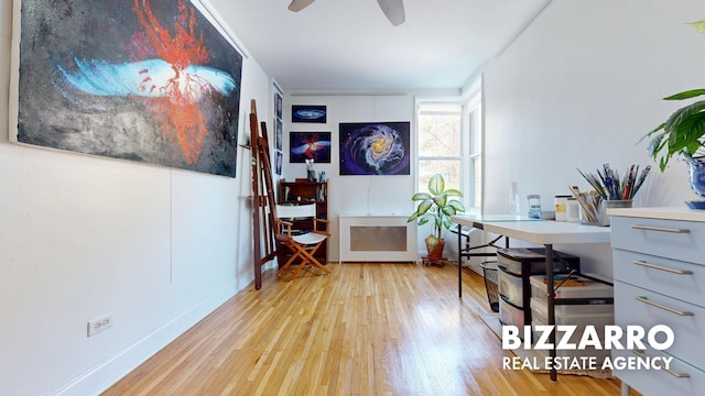 office featuring a ceiling fan and light wood-type flooring