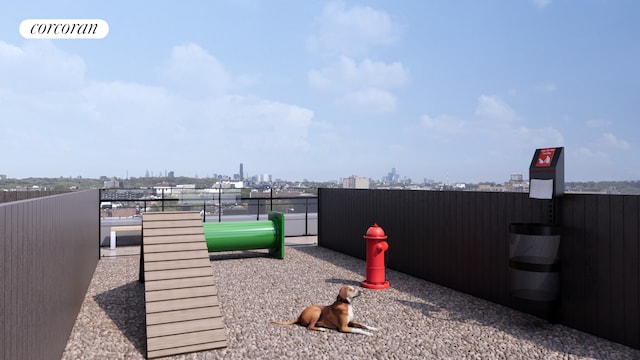 exterior space featuring fence, a city view, and visible vents