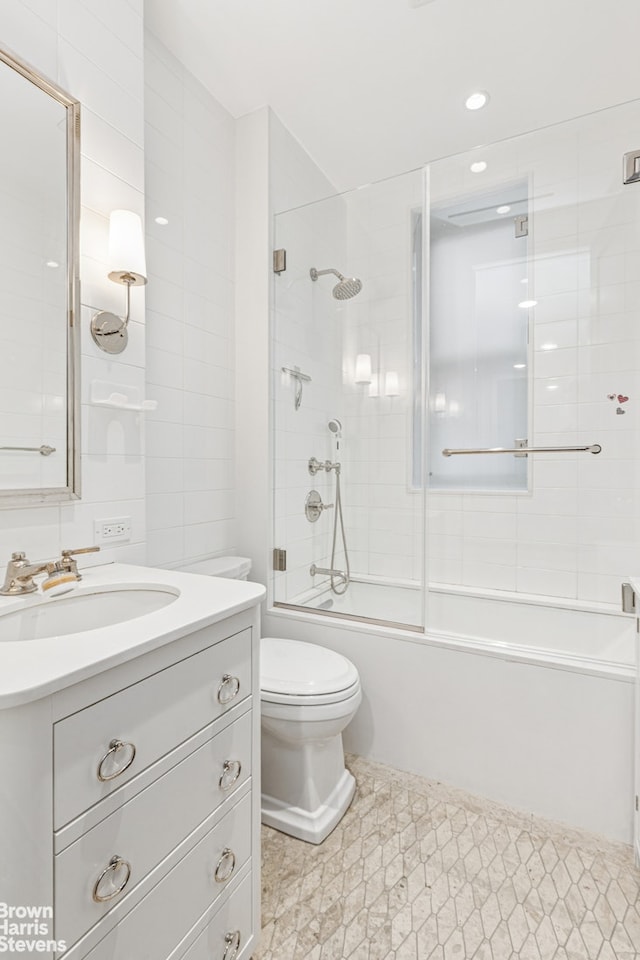 498 W End Ave Unit 3C, New York City, NY 10024 - full bath with vanity, toilet, enclosed tub / shower combo, and recessed lighting
