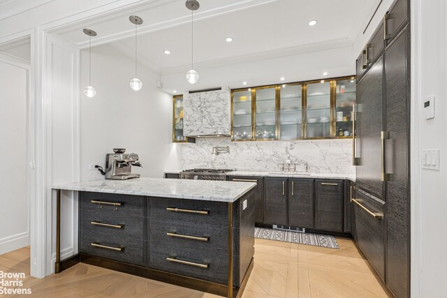 498 W End Ave Unit 3C, New York City, NY 10024 - indoor wet bar featuring decorative backsplash, wall chimney range hood, ornamental molding, pendant lighting, and recessed lighting