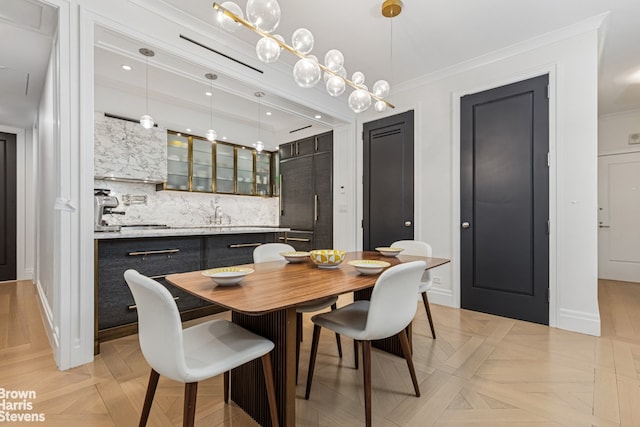 dining room with crown molding and baseboards