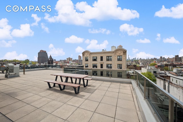 view of patio / terrace with a city view and a balcony