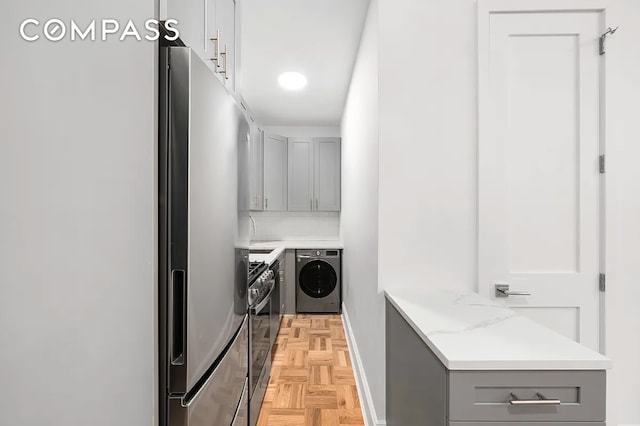 134 W 80th St Unit 2R, New York City, NY 10024 - laundry area featuring washer and dryer