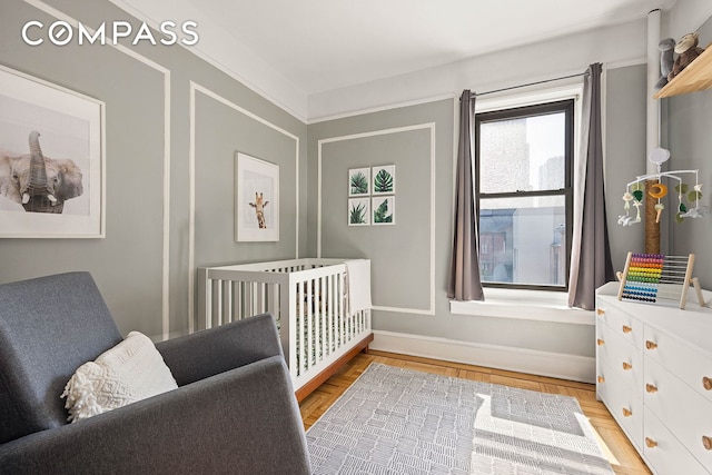 bedroom featuring a crib