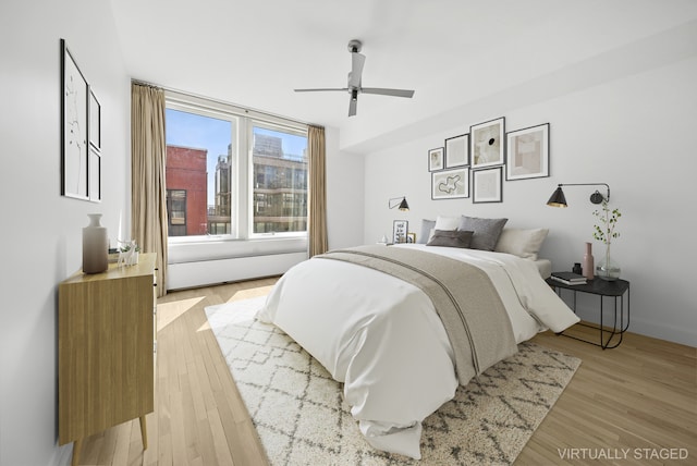 121 W 19th St Unit 9E, New York City, NY 10011 - bedroom with light wood-style flooring and a ceiling fan
