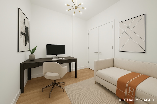 121 W 19th St Unit 9E, New York City, NY 10011 - office area featuring light wood-style floors and a chandelier