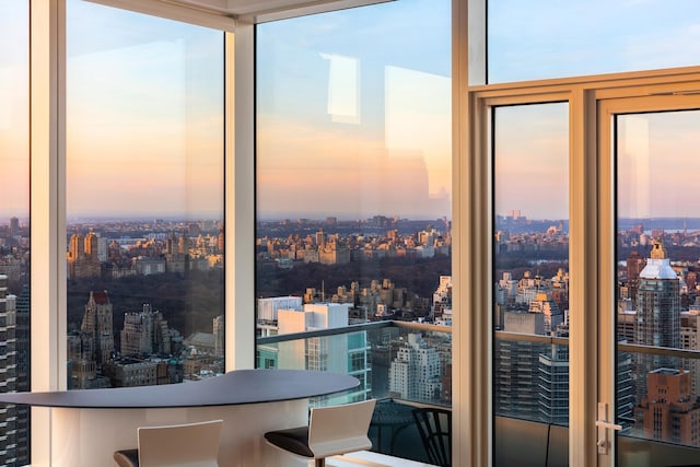 sunroom featuring a view of city