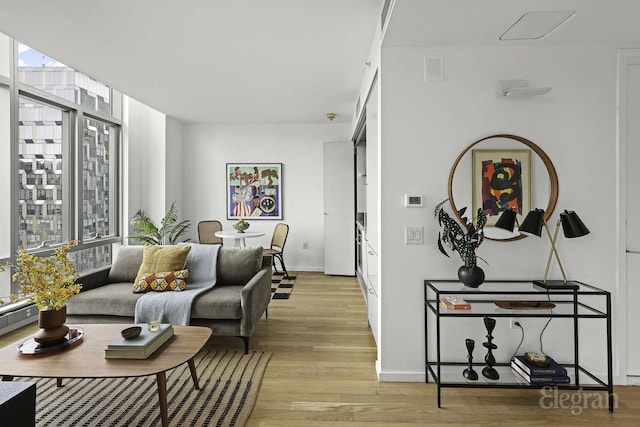 18 W 48th St Phd, Phd, New York City, NY 10036 - living area with light wood-style floors, baseboards, and visible vents