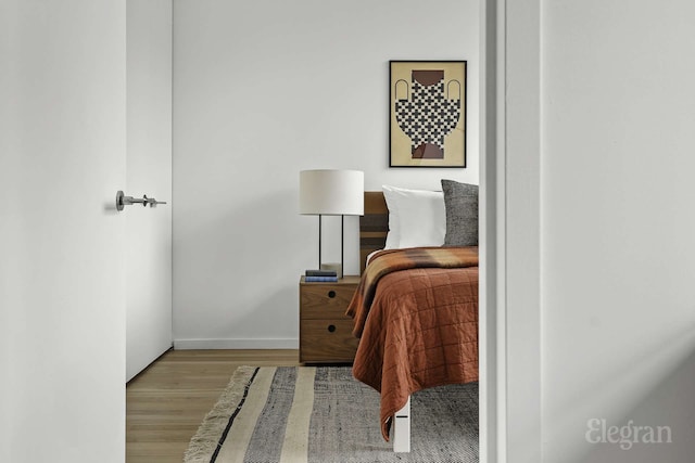 18 W 48th St Phd, Phd, New York City, NY 10036 - bedroom featuring baseboards and wood finished floors