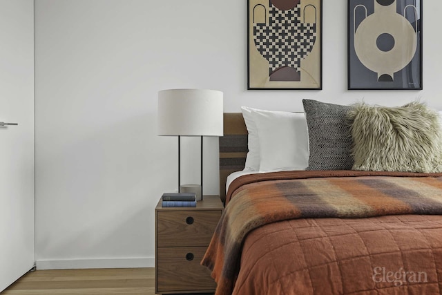 18 W 48th St Phd, Phd, New York City, NY 10036 - bedroom featuring baseboards and wood finished floors
