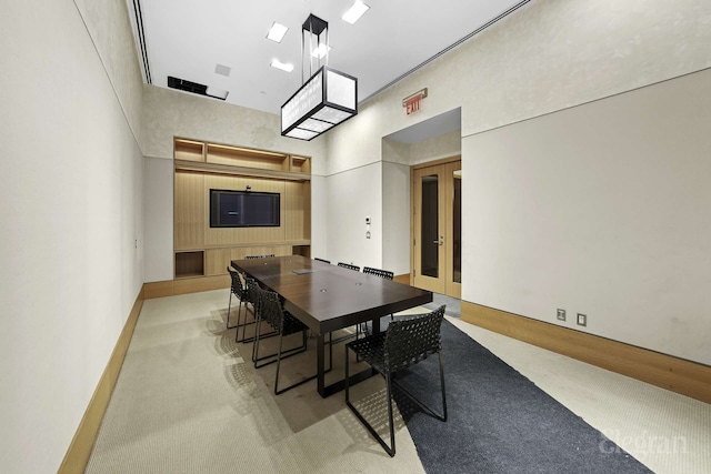 18 W 48th St Phd, Phd, New York City, NY 10036 - dining area featuring baseboards, a high ceiling, light colored carpet, and french doors