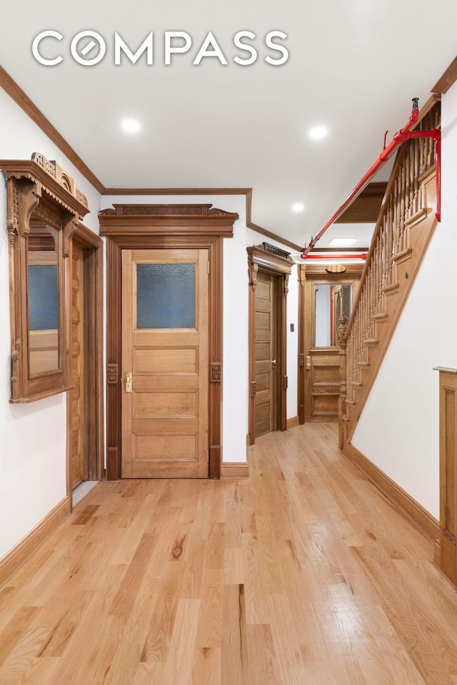 632 W 158th St, New York City, NY 10032 - corridor with ornamental molding, baseboards, stairs, light wood finished floors, and recessed lighting