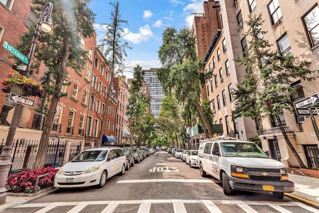 433 E 51st St Unit 3G, New York City, NY 10022 - view of road with curbs, street lights, and sidewalks