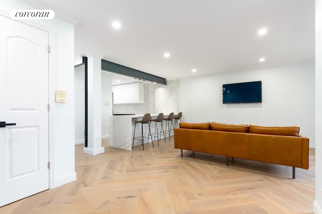 living room with baseboards, recessed lighting, ornate columns, and visible vents