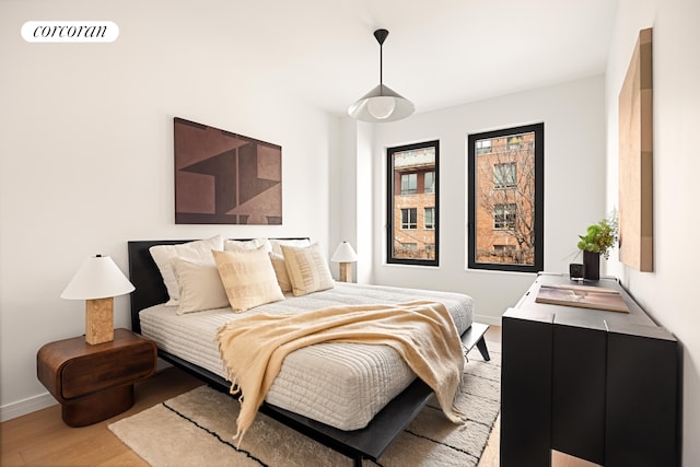 630 Grand Ave Unit 407, New York City, NY 11238 - bedroom with light wood-style flooring and baseboards