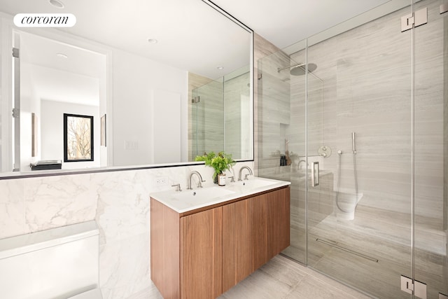 630 Grand Ave Unit 407, New York City, NY 11238 - full bathroom with double vanity, tile walls, and a stall shower