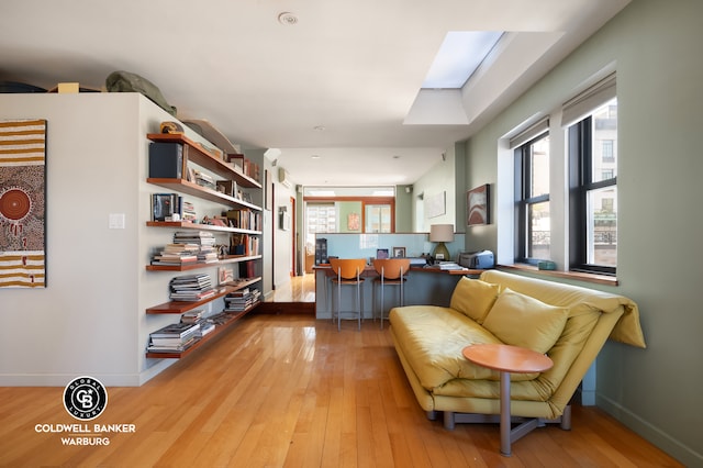 115 E 61st St Ph, Ph, New York City, NY 10065 - sitting room featuring light wood-style floors, baseboards, and a skylight