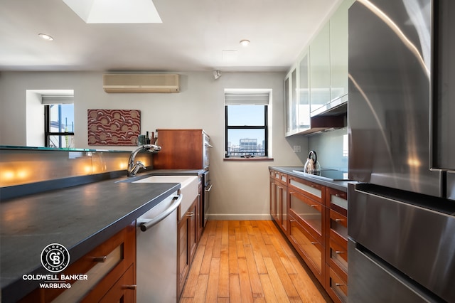 115 E 61st St Ph, Ph, New York City, NY 10065 - kitchen with stainless steel appliances, a wall unit AC, plenty of natural light, baseboards, and recessed lighting
