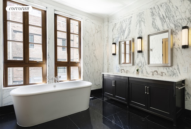 full bathroom with crown molding, plenty of natural light, a soaking tub, and double vanity