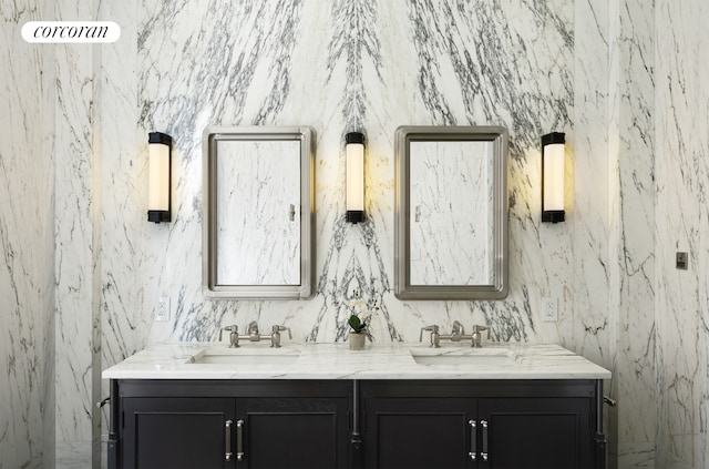 bathroom with double vanity and a sink