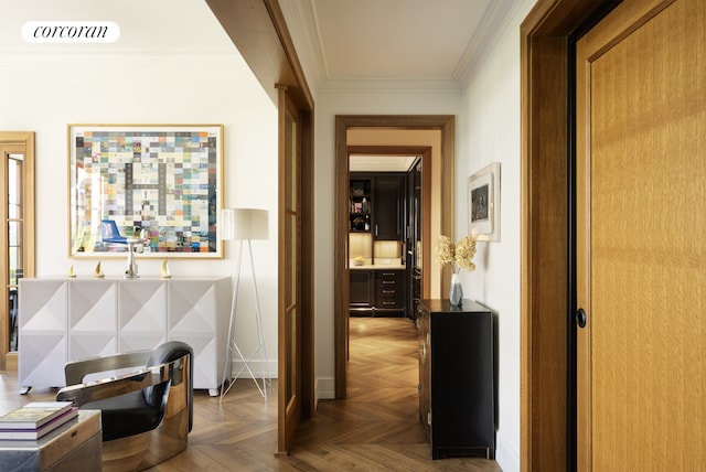 corridor with crown molding, baseboards, and visible vents