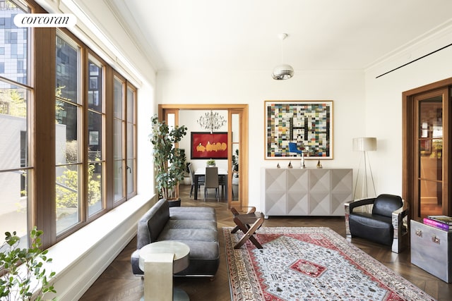 living area with crown molding