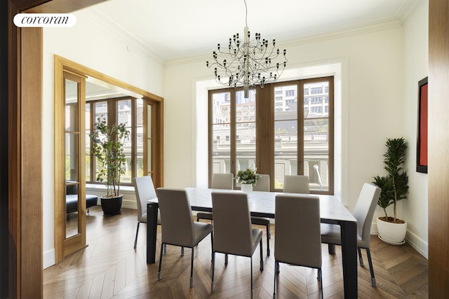 dining room featuring an inviting chandelier, ornamental molding, baseboards, and visible vents