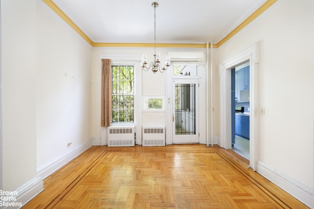 unfurnished dining area featuring an inviting chandelier, radiator, and baseboards