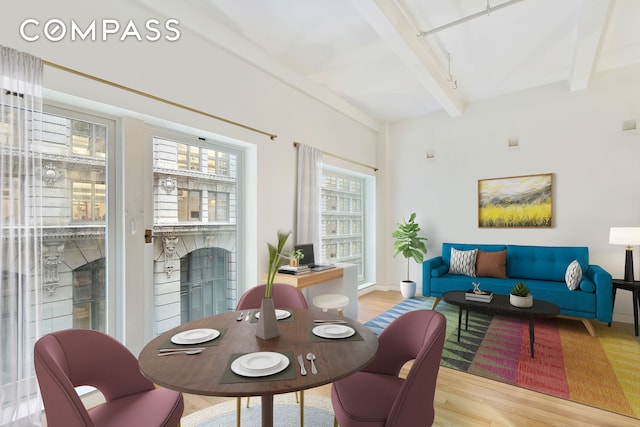 16 W 19th St Unit 3A, New York City, NY 10011 - dining area with wood finished floors, beamed ceiling, rail lighting, and baseboards