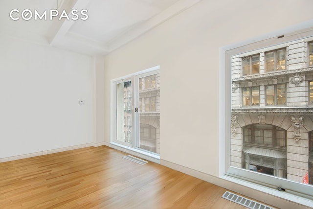 16 W 19th St Unit 3A, New York City, NY 10011 - unfurnished room featuring wood finished floors, baseboards, and beam ceiling