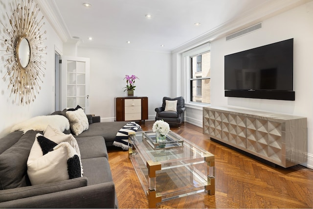 living area with ornamental molding, baseboards, and recessed lighting