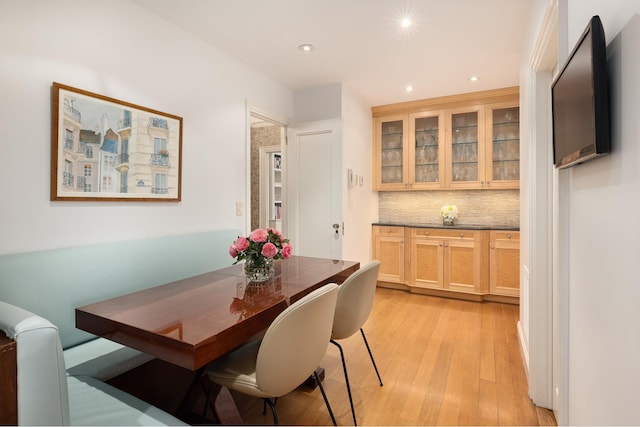 dining room featuring light wood-type flooring and recessed lighting