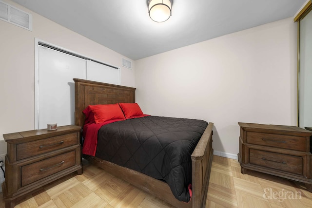 bedroom featuring visible vents