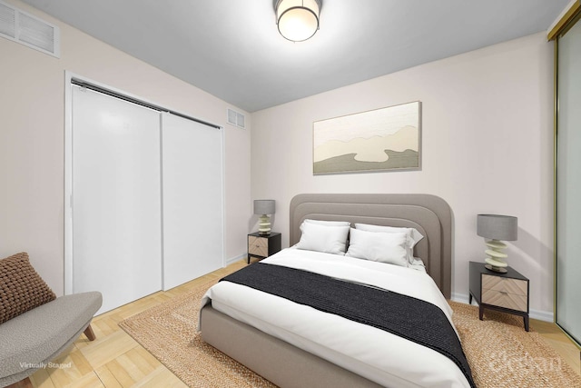 bedroom featuring a closet and visible vents