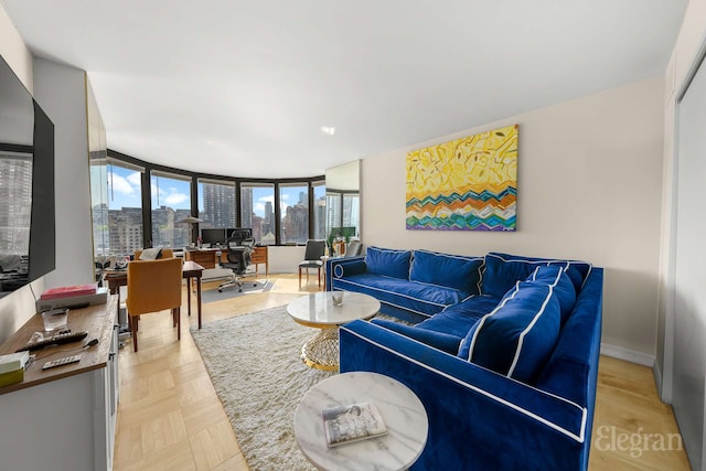 living area featuring baseboards