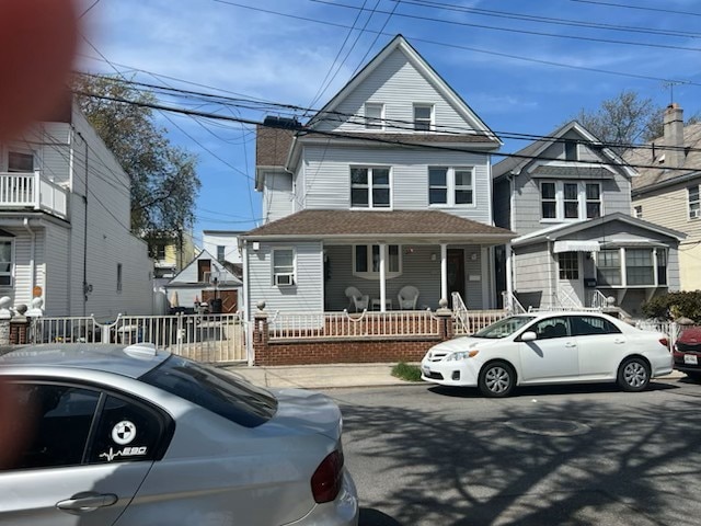 victorian house featuring fence private yard and covered porch