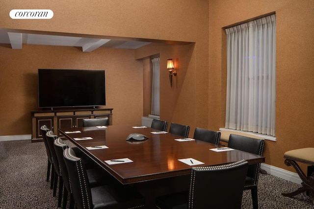 dining space with carpet flooring, baseboards, and visible vents