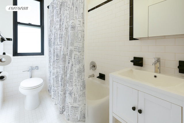 full bath featuring vanity, toilet, tile walls, tile patterned floors, and backsplash
