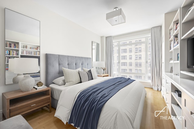 bedroom featuring light wood-style floors