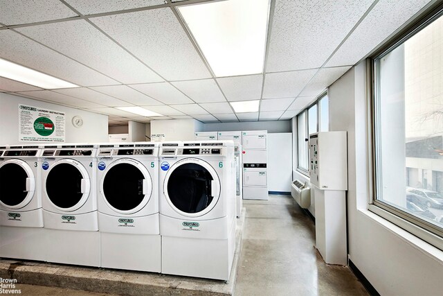 community laundry room with independent washer and dryer and stacked washer and dryer