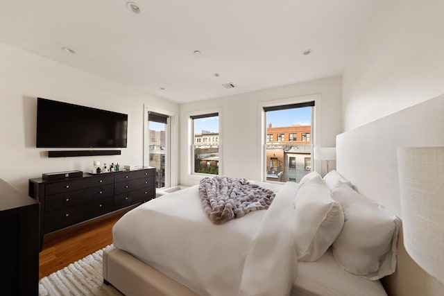 141 W 126th St Unit 4A, New York City, NY 10027 - bedroom with wood finished floors and recessed lighting