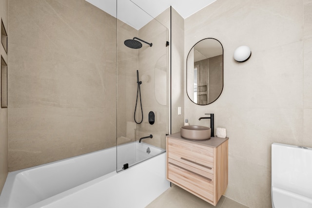 full bath featuring vanity and washtub / shower combination
