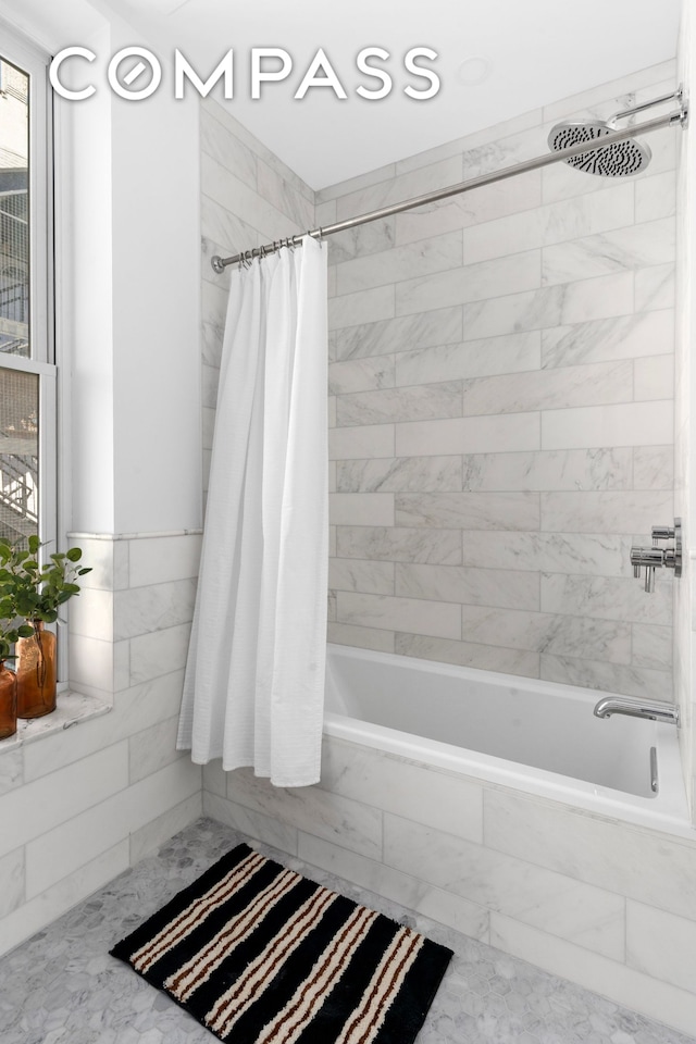 1370 Dean St Unit B, New York City, NY 11216 - bathroom with marble look tile flooring and tiled shower / bath combo