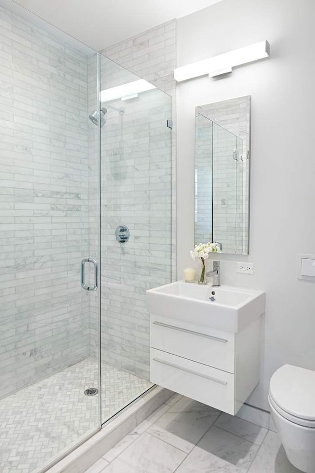 16 E 80th St Unit 4B5Bc, New York City, NY 10075 - full bathroom with a shower stall, vanity, and toilet